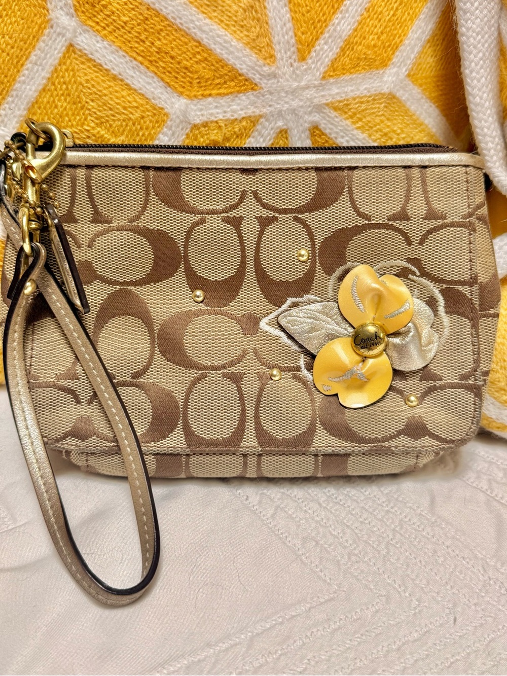 Coach Beige/Brown Signature Canvas Wristlet with Yellow Floral Accent